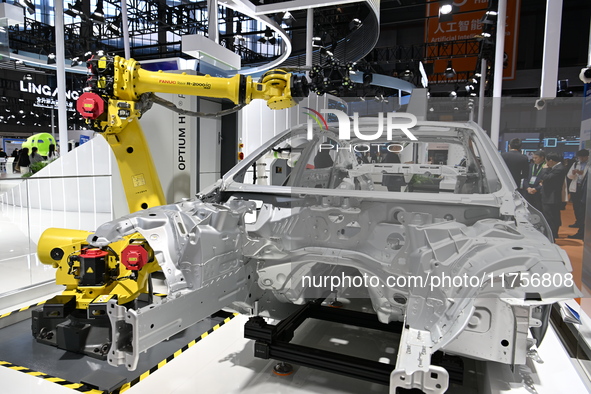 Hexagon's 3D composite inspection system performs a quality inspection demonstration on a vehicle in the Technical equipment exhibition area...