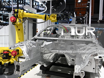 Hexagon's 3D composite inspection system performs a quality inspection demonstration on a vehicle in the Technical equipment exhibition area...