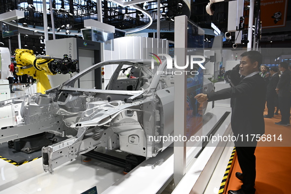 Hexagon's 3D composite inspection system performs a quality inspection demonstration on a vehicle in the Technical equipment exhibition area...