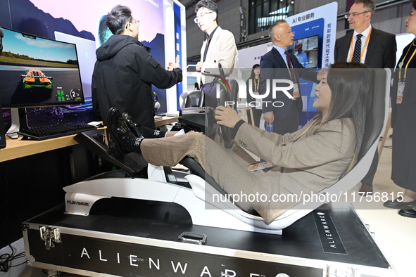 Visitors explore Hexagon's new technologies, achievements, and exhibits in the technical equipment exhibition area of the 7th China Internat...