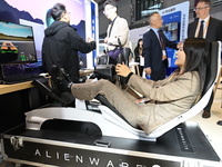 Visitors explore Hexagon's new technologies, achievements, and exhibits in the technical equipment exhibition area of the 7th China Internat...