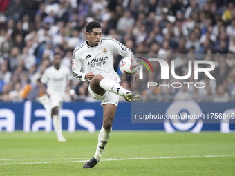 Jude Bellingham of Real Madrid scores a goal during the La Liga 2024/25 match between Real Madrid and Osasuna at Santiago Bernabeu Stadium i...