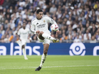 Jude Bellingham of Real Madrid scores a goal during the La Liga 2024/25 match between Real Madrid and Osasuna at Santiago Bernabeu Stadium i...