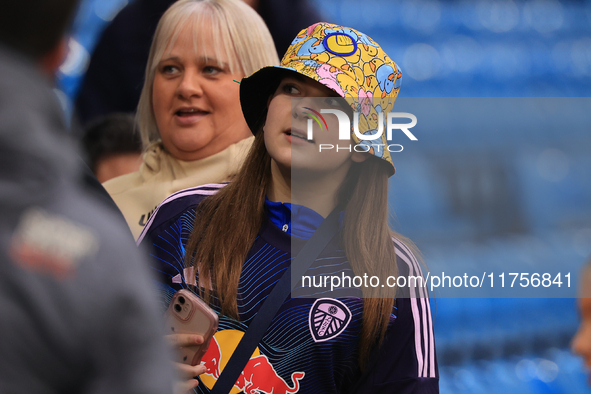 A young Leeds fan in a bucket hat stands before the Sky Bet Championship match between Leeds United and Queens Park Rangers at Elland Road i...