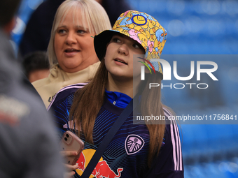 A young Leeds fan in a bucket hat stands before the Sky Bet Championship match between Leeds United and Queens Park Rangers at Elland Road i...