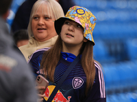 A young Leeds fan in a bucket hat stands before the Sky Bet Championship match between Leeds United and Queens Park Rangers at Elland Road i...