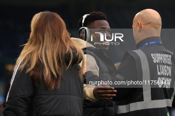 Willy Gnonto (Leeds United) rubs the head of a supporter liaison officer before the Sky Bet Championship match between Leeds United and Quee...