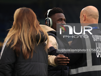 Willy Gnonto (Leeds United) rubs the head of a supporter liaison officer before the Sky Bet Championship match between Leeds United and Quee...