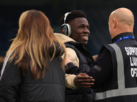 Willy Gnonto (Leeds United) rubs the head of a supporter liaison officer before the Sky Bet Championship match between Leeds United and Quee...