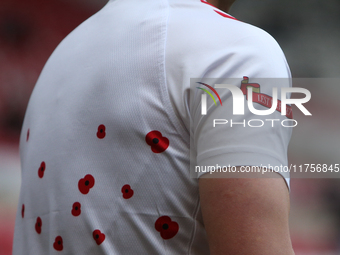 Sunderland goalkeeper Simon Moore has 'Lest We Forget' printed on his warm-up shirt during the Sky Bet Championship match between Sunderland...