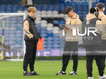 Sam Chambers (Leeds United) walks the pitch with Charlie Crew (Leeds United) before the Sky Bet Championship match between Leeds United and...