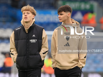 Sam Chambers (Leeds United) walks the pitch with Charlie Crew (Leeds United) before the Sky Bet Championship match between Leeds United and...