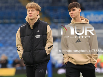 Sam Chambers (Leeds United) walks the pitch with Charlie Crew (Leeds United) before the Sky Bet Championship match between Leeds United and...