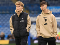 Sam Chambers (Leeds United) walks the pitch with Charlie Crew (Leeds United) before the Sky Bet Championship match between Leeds United and...