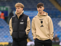 Sam Chambers (Leeds United) walks the pitch with Charlie Crew (Leeds United) before the Sky Bet Championship match between Leeds United and...