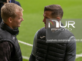 Bristol City Manager, Liam Manning, and Jack Wilshere have a conversation before the Sky Bet Championship match between Norwich City and Bri...