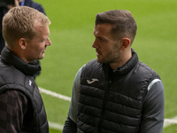 Bristol City Manager, Liam Manning, and Jack Wilshere have a conversation before the Sky Bet Championship match between Norwich City and Bri...