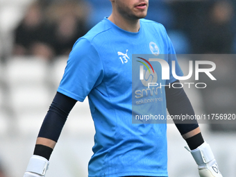 Goalkeeper Will Blackmore (28 Peterborough United) warms up during the Sky Bet League 1 match between Peterborough and Cambridge United at L...