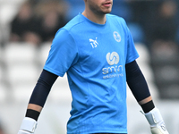 Goalkeeper Will Blackmore (28 Peterborough United) warms up during the Sky Bet League 1 match between Peterborough and Cambridge United at L...