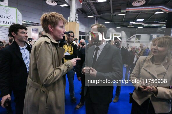 France's Minister for the Economy, Finance and Industry, Antoine Armand (center), speaks with French journalist Natacha Polony (left) as he...