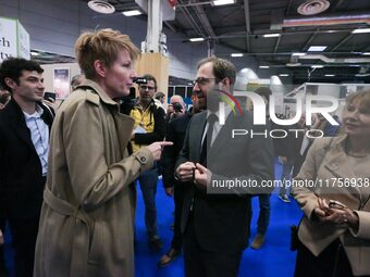 France's Minister for the Economy, Finance and Industry, Antoine Armand (center), speaks with French journalist Natacha Polony (left) as he...