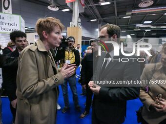 France's Minister for the Economy, Finance and Industry, Antoine Armand (center), speaks with French journalist Natacha Polony (left) as he...