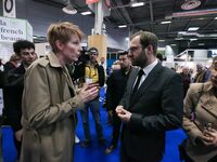 France's Minister for the Economy, Finance and Industry, Antoine Armand (center), speaks with French journalist Natacha Polony (left) as he...