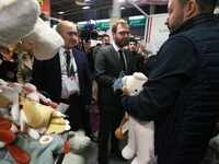 France's Minister for the Economy, Finance and Industry, Antoine Armand, examines plush toys at the ''Les Petites Maries'' brand's stand as...