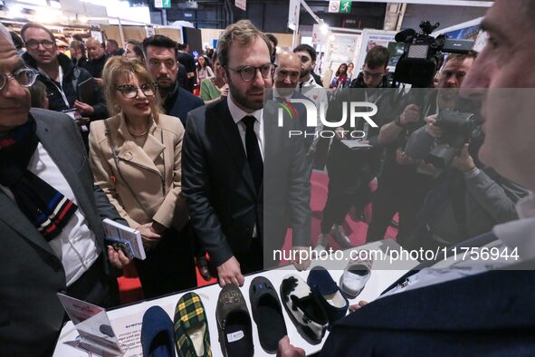 France's Minister for the Economy, Finance and Industry, Antoine Armand, speaks to personnel at the ''Airplum'' brand's stand showcasing sli...