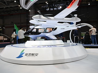 Visitors visit the Range Aviation booth at the ''Future Low Altitude Travel'' area of the Automobile Pavilion at the 7th China International...