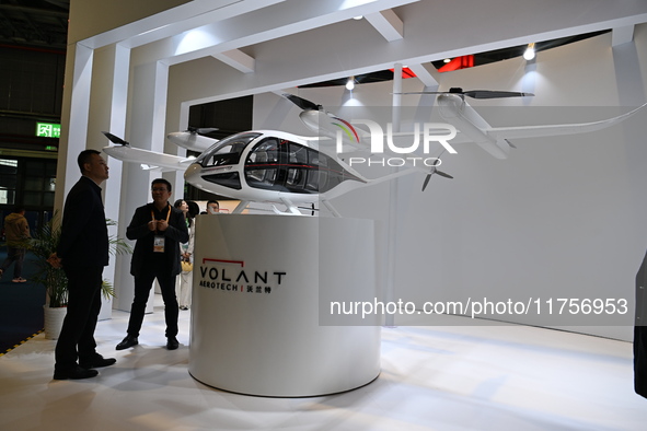 Visitors visit the VOLANT AEROTECH Aviation booth at the ''Future Low Altitude Travel'' area of the Automobile Pavilion at the 7th China Int...