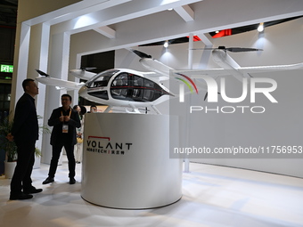 Visitors visit the VOLANT AEROTECH Aviation booth at the ''Future Low Altitude Travel'' area of the Automobile Pavilion at the 7th China Int...