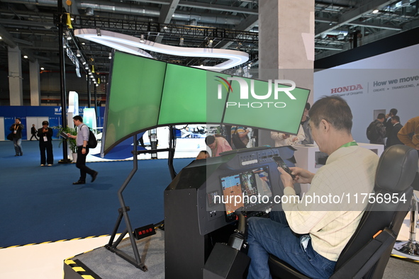 Visitors visit the Honda booth at the ''Future Low Altitude Travel'' area of the Automobile Pavilion at the 7th China International Import E...