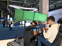 Visitors visit the Honda booth at the ''Future Low Altitude Travel'' area of the Automobile Pavilion at the 7th China International Import E...