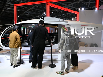 Visitors visit the VOLANT AEROTECH Aviation booth at the ''Future Low Altitude Travel'' area of the Automobile Pavilion at the 7th China Int...