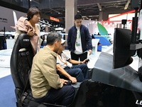 Visitors visit the Honda booth at the ''Future Low Altitude Travel'' area of the Automobile Pavilion at the 7th China International Import E...