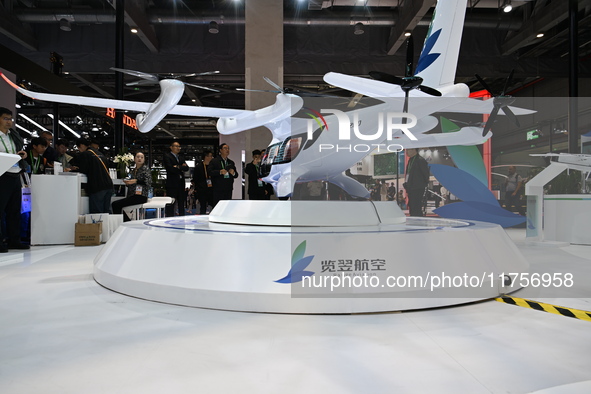 Visitors visit the Range Aviation booth at the ''Future Low Altitude Travel'' area of the Automobile Pavilion at the 7th China International...