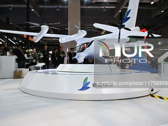 Visitors visit the Range Aviation booth at the ''Future Low Altitude Travel'' area of the Automobile Pavilion at the 7th China International...