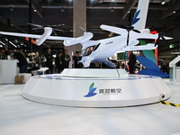 Visitors visit the Range Aviation booth at the ''Future Low Altitude Travel'' area of the Automobile Pavilion at the 7th China International...