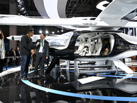 Visitors visit the vertaxi booth in the ''Future Low Altitude Travel'' area of the Automobile Pavilion at the 7th China International Import...