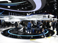 Visitors visit the vertaxi booth in the ''Future Low Altitude Travel'' area of the Automobile Pavilion at the 7th China International Import...