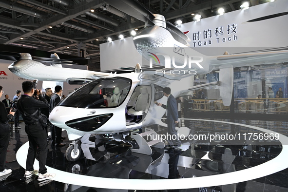 Visitors visit the Tcab Tech booth at the ''Future Low Altitude Travel'' area of the Automobile Pavilion at the 7th China International Impo...