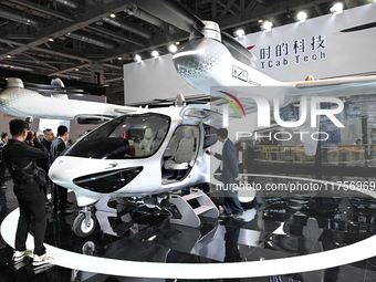 Visitors visit the Tcab Tech booth at the ''Future Low Altitude Travel'' area of the Automobile Pavilion at the 7th China International Impo...