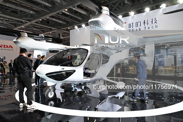 Visitors visit the Tcab Tech booth at the ''Future Low Altitude Travel'' area of the Automobile Pavilion at the 7th China International Impo...