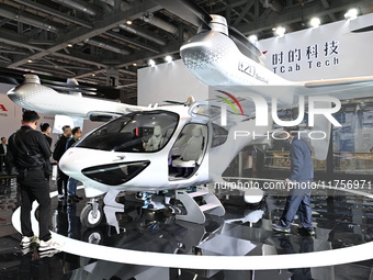 Visitors visit the Tcab Tech booth at the ''Future Low Altitude Travel'' area of the Automobile Pavilion at the 7th China International Impo...