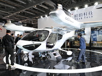 Visitors visit the Tcab Tech booth at the ''Future Low Altitude Travel'' area of the Automobile Pavilion at the 7th China International Impo...