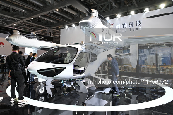 Visitors visit the Tcab Tech booth at the ''Future Low Altitude Travel'' area of the Automobile Pavilion at the 7th China International Impo...