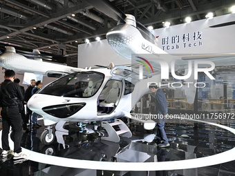 Visitors visit the Tcab Tech booth at the ''Future Low Altitude Travel'' area of the Automobile Pavilion at the 7th China International Impo...