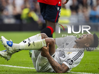 Eder Militao of Real Madrid CF is injured on the ground during the La Liga EA Sports 2024/25 football match between Real Madrid CF and CA Os...