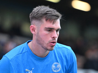 Goalkeeper Will Blackmore (28 Peterborough United) warms up during the Sky Bet League 1 match between Peterborough and Cambridge United at L...